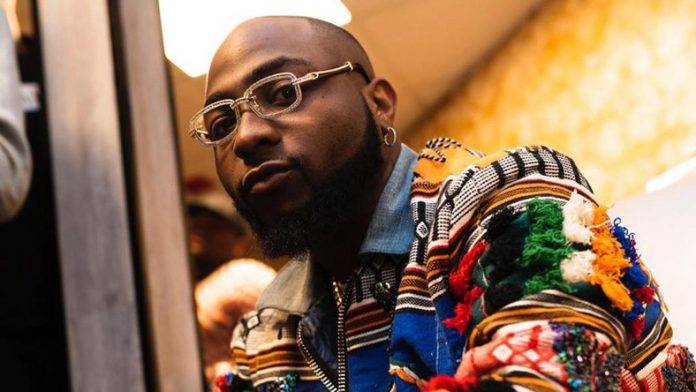 ‘Another Baby Mama Loading,’ Twitter Agog As Photos Of Davido Kissing American Model Surface