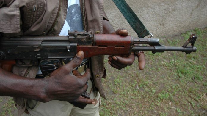 gunmen carrying Ak-47 riffle