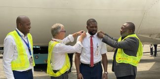L-R Dana Air's Accountable Manager, Obi Mbanuzuo, Chief Pilot Captain John Hazel, newly decorated B737 Captain Andrew Igbe-Arase, and Director of Flight Operations, Captain Segun Omole during the decoration of captain Andrew Igbe-Arase as a captain on Dana Air's Boeing 737 aircraft in Lagos recently. 