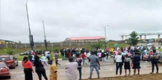 Students block lagos airport road
