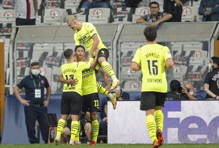 Dortmund players celebrate after Dortmund’s Jude Bellingham scored his side’s opening goal during the Champions League Group C soccer match between Besiktas and Borussia Dortmund at the Vodafone Park Stadium in Istanbul, Turkey, Wednesday, Sept. 15, 2021. (AP Photo)